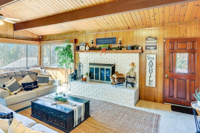 633 Arth Dr, Crestline, CA 92325 - carpeted living room with wooden ceiling, wooden walls, a fireplace, and a wealth of natural light