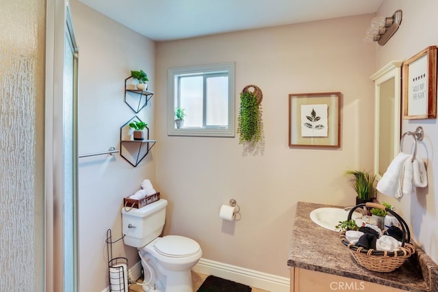 633 Arth Dr, Crestline, CA 92325 - bathroom featuring vanity, toilet, and baseboards