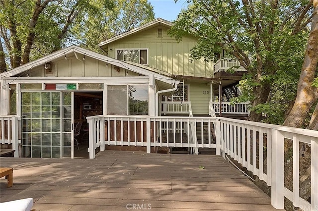 exterior space featuring a wooden deck and board and batten siding