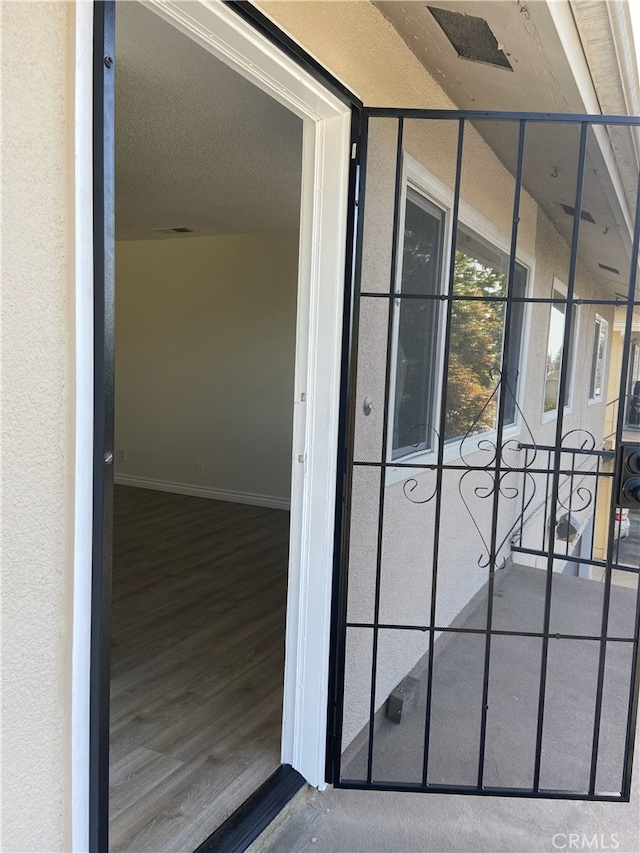 entrance to property with stucco siding