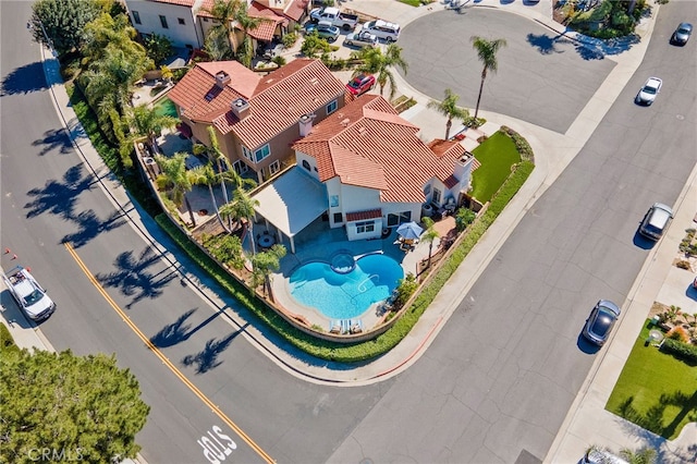 birds eye view of property with a residential view