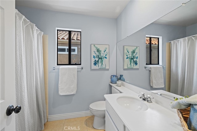 bathroom featuring tile patterned floors, a shower with curtain, toilet, baseboards, and vanity