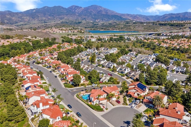 birds eye view of property featuring a mountain view and a residential view