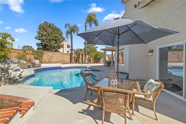 view of pool with outdoor dining space, a patio, a fenced backyard, and a fenced in pool