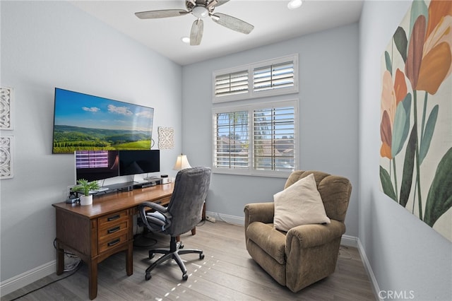 office space with ceiling fan, baseboards, and wood finished floors