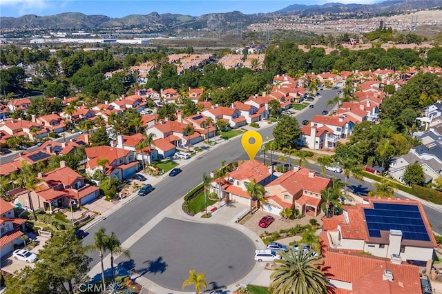 birds eye view of property with a mountain view and a residential view