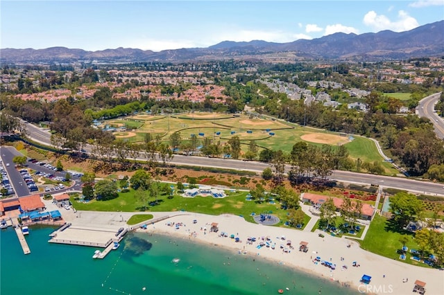 drone / aerial view with a water and mountain view