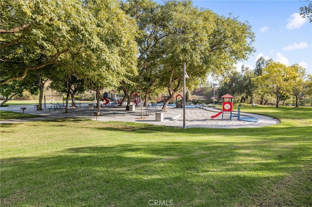 surrounding community featuring a yard and playground community