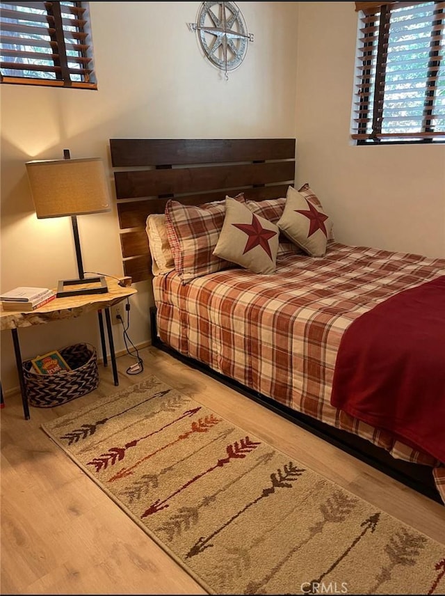 bedroom featuring wood finished floors