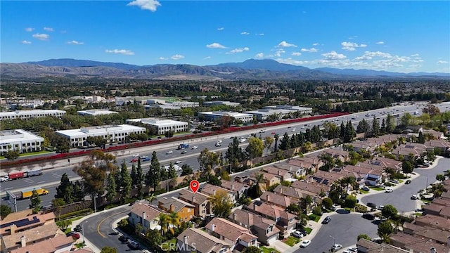 drone / aerial view featuring a mountain view