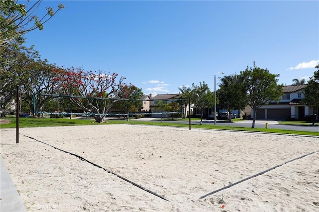 view of property's community with a residential view and volleyball court