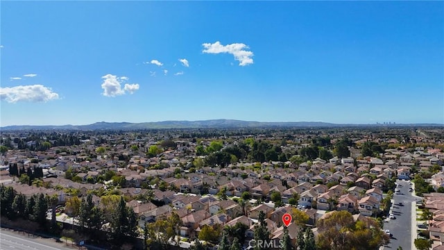 birds eye view of property featuring a mountain view and a residential view