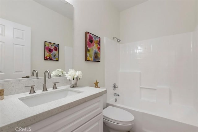 full bath featuring washtub / shower combination, vanity, and toilet