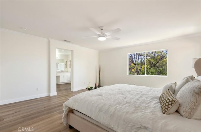 bedroom with baseboards, visible vents, a ceiling fan, ornamental molding, and wood finished floors