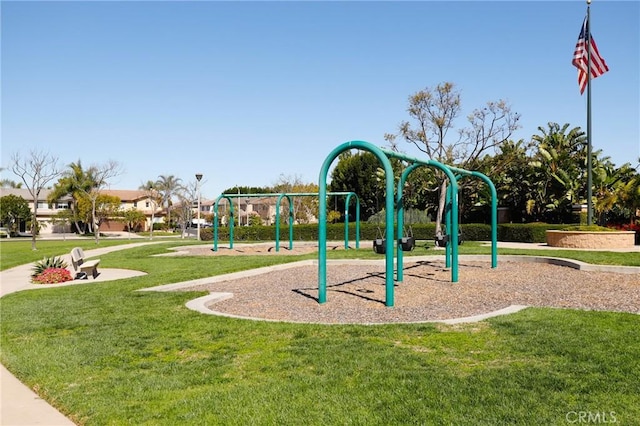 communal playground featuring a yard