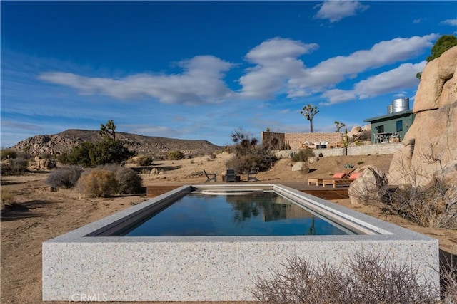 outdoor pool with a mountain view