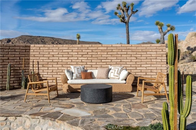 view of patio / terrace featuring fence and an outdoor living space