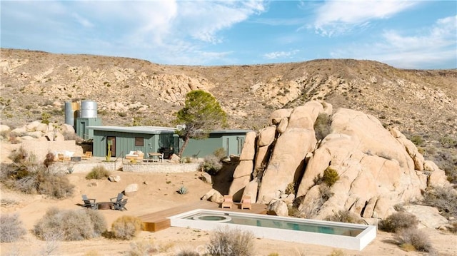 details with a mountain view and a jacuzzi