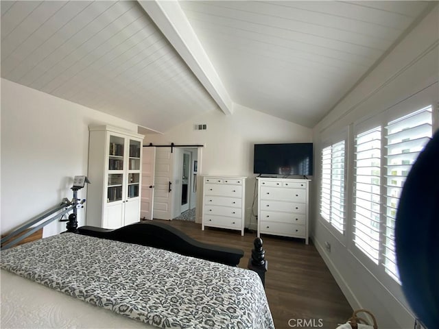 bedroom with visible vents, lofted ceiling with beams, a barn door, and wood finished floors