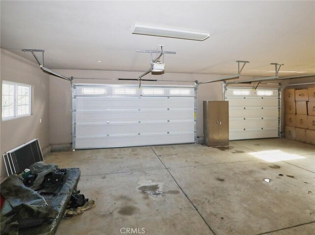 garage featuring a garage door opener