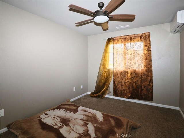 carpeted bedroom featuring a ceiling fan, visible vents, baseboards, and a wall mounted air conditioner