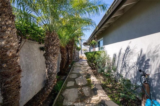 view of side of home with stucco siding