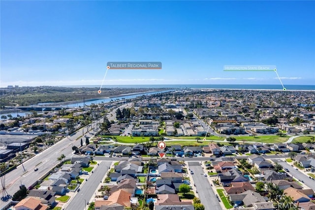 bird's eye view featuring a water view and a residential view