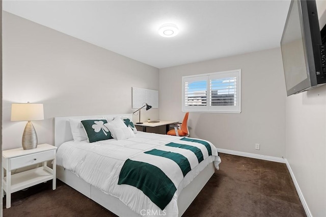 bedroom featuring carpet floors and baseboards