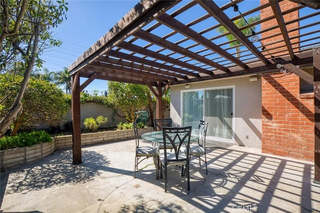 view of patio / terrace with outdoor dining area and a pergola