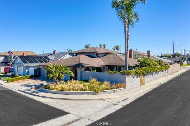 view of front of property featuring concrete driveway and a residential view