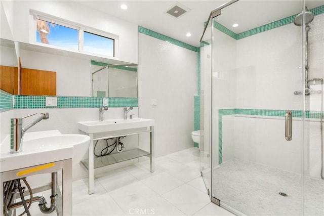 full bath with a stall shower, visible vents, toilet, tile patterned flooring, and recessed lighting