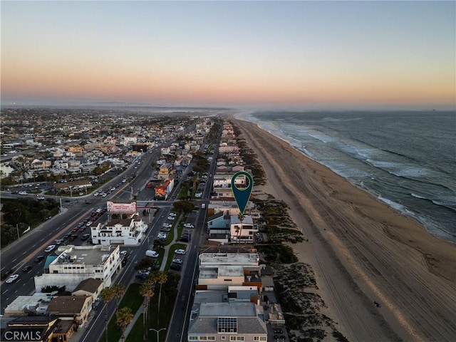 bird's eye view featuring a view of the beach and a water view