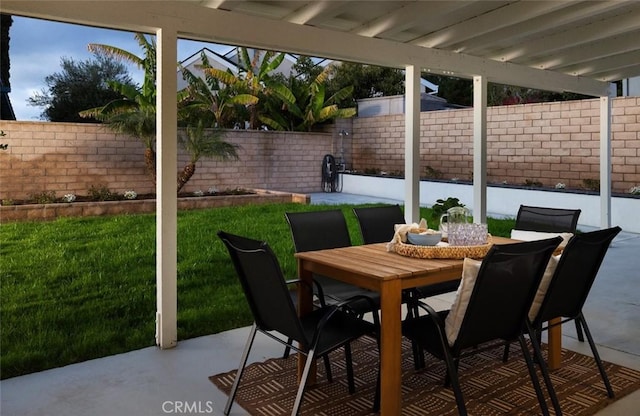 view of patio / terrace featuring outdoor dining area and a fenced backyard