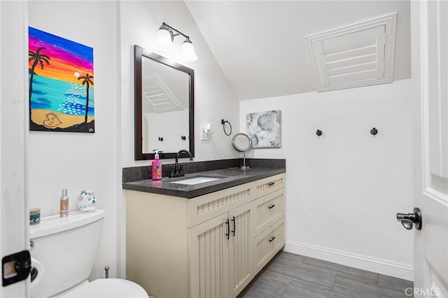 33210 Crown Valley Rd, Temecula, CA 92592 - half bath with vanity, toilet, vaulted ceiling, and baseboards