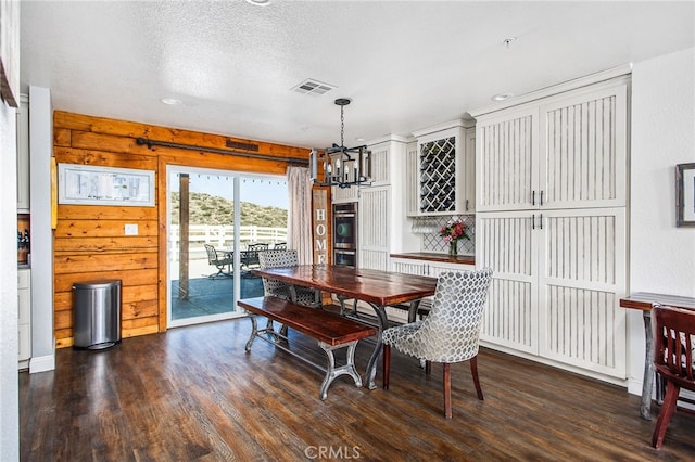 33210 Crown Valley Rd, Temecula, CA 92592 - dining room featuring a chandelier, dark wood-style floors, and a textured ceiling