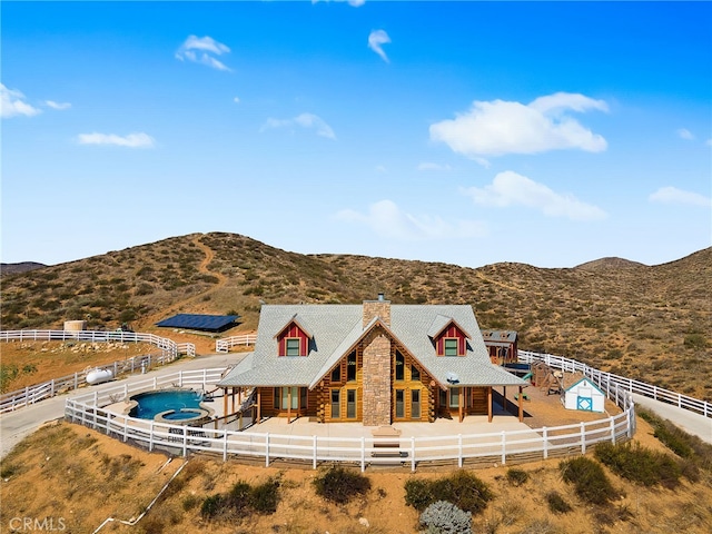 birds eye view of property featuring a mountain view