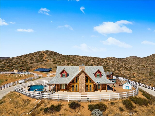 33210 Crown Valley Rd, Temecula, CA 92592 - back of property with log siding, a chimney, a mountain view, and a fenced backyard