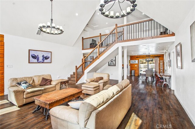 33210 Crown Valley Rd, Temecula, CA 92592 - living room with a chandelier, wood finished floors, high vaulted ceiling, stairs, and baseboards
