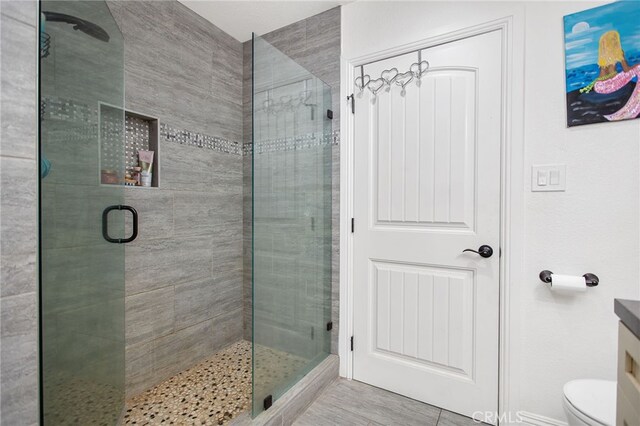 33210 Crown Valley Rd, Temecula, CA 92592 - bathroom featuring a stall shower, toilet, and vanity