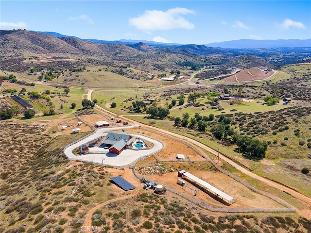 drone / aerial view featuring a rural view and a mountain view