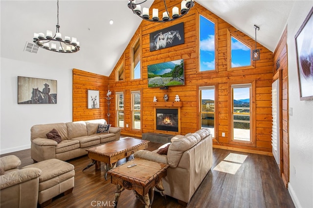 33210 Crown Valley Rd, Temecula, CA 92592 - living room featuring a chandelier, baseboards, wooden walls, high vaulted ceiling, and dark wood-type flooring