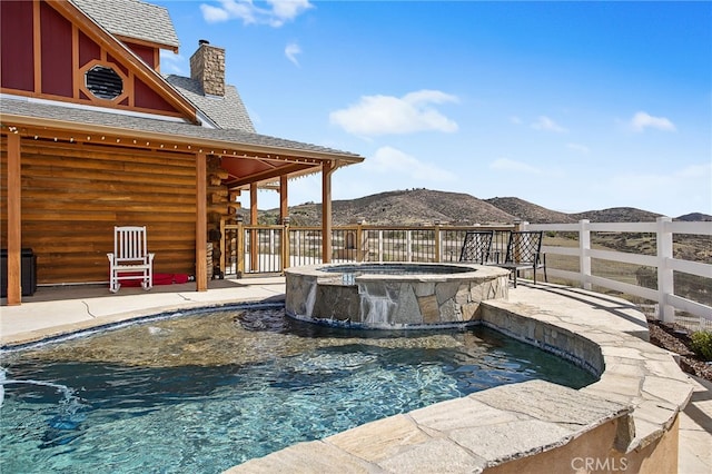 33210 Crown Valley Rd, Temecula, CA 92592 - view of pool featuring a mountain view, a pool with connected hot tub, a patio area, and fence