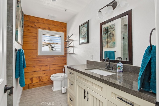33210 Crown Valley Rd, Temecula, CA 92592 - bathroom with wooden walls, toilet, vanity, and a shower