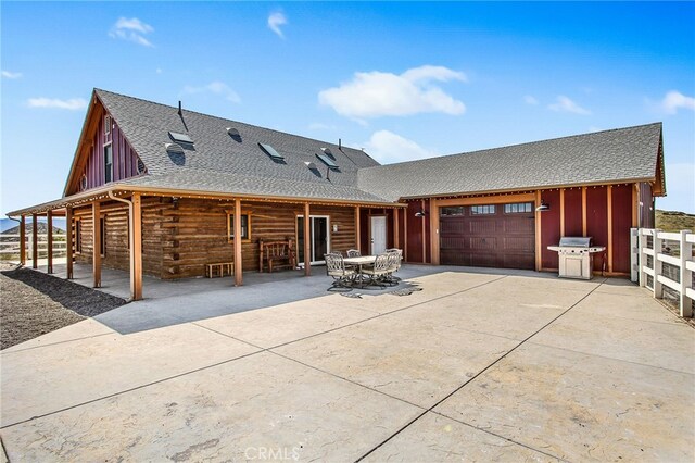 33210 Crown Valley Rd, Temecula, CA 92592 - view of front of house featuring concrete driveway, an attached garage, a shingled roof, and log siding