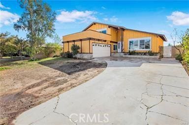 view of front facade with driveway and an attached garage