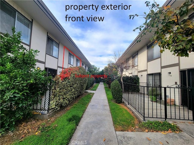 view of property's community with fence