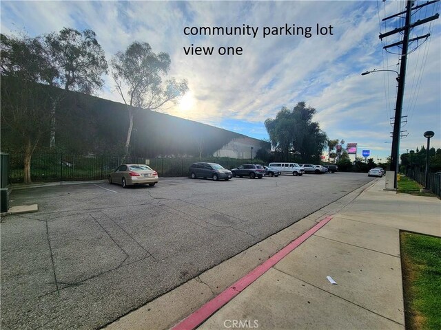 view of street featuring curbs, street lighting, and sidewalks