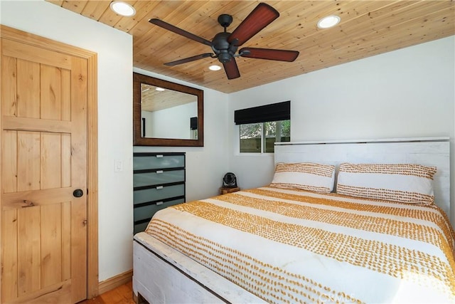 bedroom with ceiling fan, wooden ceiling, and recessed lighting