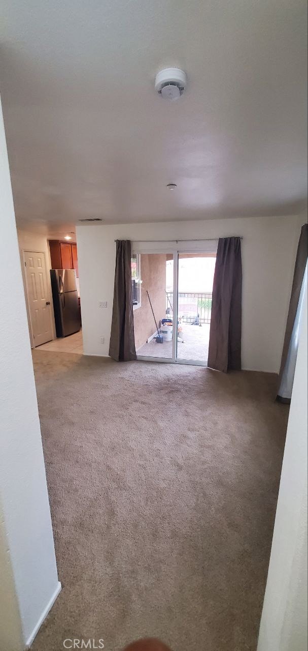 empty room featuring light colored carpet