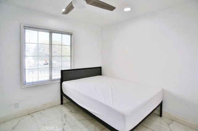 bedroom featuring marble finish floor, recessed lighting, and baseboards